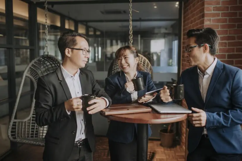 5 life skills to master 3 people chatting at a small table